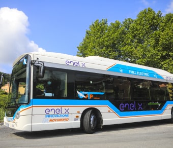 Electric bus moving along a street