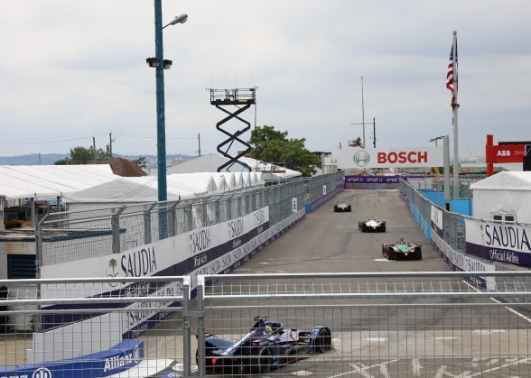 Three cars racing in the Formula E in New York