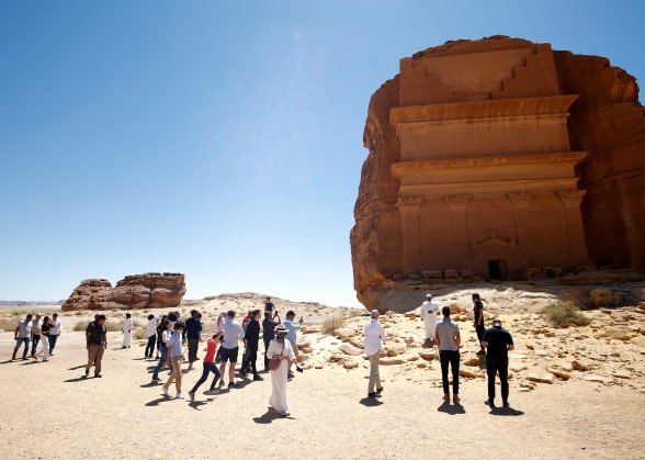 People in a desert landscape in Saudi Arabia